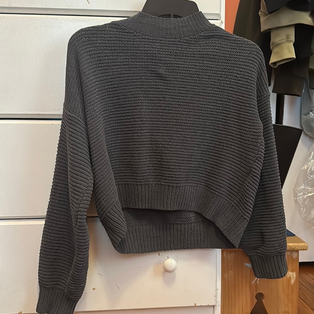 This gray sweater is a size Xs from hollister.